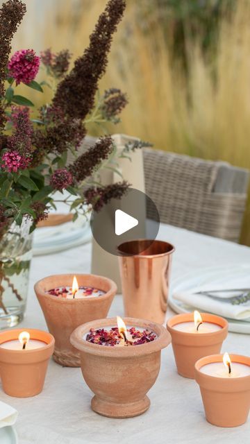 Sugar & Charm / Eden Passante on Instagram: "Create your own charming and affordable candles for gatherings with this easy DIY using mini terracotta pots, soy wax, wicks, pennies, and sticks 🕯️

These look beautiful for a fall outdoor gathering and are very easy to make. 

BOOKMARK and SAVE this posts next time you’re hosting a gathering! You will love watching the glow of these cute handmade terracotta candles.

DIY Terracotta Candles
2 lb soy wax
wicks (small)
pennies
small twigs
mini terracotta planters 
essential oils or scents of your choice 
glue 
scissors 
double boiler or microwave-safe container for melting wax 
heat-resistant measuring cup 
stirring utensil

Directions
Glue a penny to the bottom of the terracotta pot to secure the hole.
Follow the steps for melting candle wax on Terracotta Diy Ideas, Melting Candle Wax, Terracotta Candles, Mini Terracotta Pots, Hygge Crafts, Terracotta Candle, Soiree Ideas, Melting Candle, Fall Candles Diy