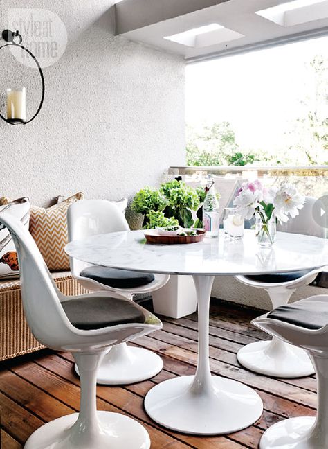 A marble-topped table keeps this balcony feeling indoorsy and makes a lovely outdoor living space. {PHOTO: Donna Griffith} Marble Tulip Table, Tulip Chairs, Spacious Balcony, Balcony Style, Porch Table, Modern Balcony, Modern Condo, Tulip Chair, Tulip Table