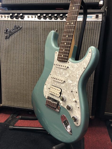 A cool Fender with vintage vibe, this 2000 American Series Fat Stratocaster features a teal green metallic finish, pearloid pickguard and backplate, and American Series tremolo, tuners, and hardware. Comes equipped with a Seymour Duncan Pearly Gates... Guitar Chord Progressions, Music Corner, Chord Progressions, Pearly Gates, Green Electric, Guitar Chords And Lyrics, Guitar Obsession, Guitar Pics, American Series