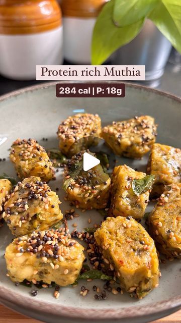 Aasra | Conscious cooking for the Indian palate 👩🏽‍🍳 on Instagram: "Get 18g of protein from this delicious Gujarati snack/breakfast recipe—Muthia!

Adding protein to your favorite meals is the easiest way to upgrade your diet. This recipe shows how you can sneak protein into your meals without making drastic changes. The taste of Muthias remains the same, but they become more nutritious and balanced, keeping you full for hours.

High-protein meals help you stay full longer, reduce hunger pangs, and keep you on track with your overall calorie and weight goals. 

If you try this recipe, please tag me or send a DM—I’d love to hear your thoughts!”

Nutritional value (approx): 284 cal per serving 
Contains 6-8 bites of muthias
C: 28g | P: 18g | F: 11g

Ingredients (serves 3-4 people, you can High Protein Indian Breakfast, High Protein Breakfast Vegetarian, Muthia Recipe, Stay Full Longer, Food Reels, Gujarati Snacks, Hunger Pangs, Weight Goals, Chilli Paste