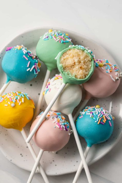 Learn to make homemade cake pops from scratch! This recipe uses made from scratch cake with a secret ingredient and homemade cream cheese frosting. Switch up the candy coating with colors that correlate to the occasion. Here I used spring colors to make Easter cake pops! Easy Cake Pops, Pops Recipes, Easter Cake Pops, Brittle Recipes, Cake Pop Stands, Cookie Bakery, Cake Pops How To Make, Spring Cake, Cake Pop Recipe