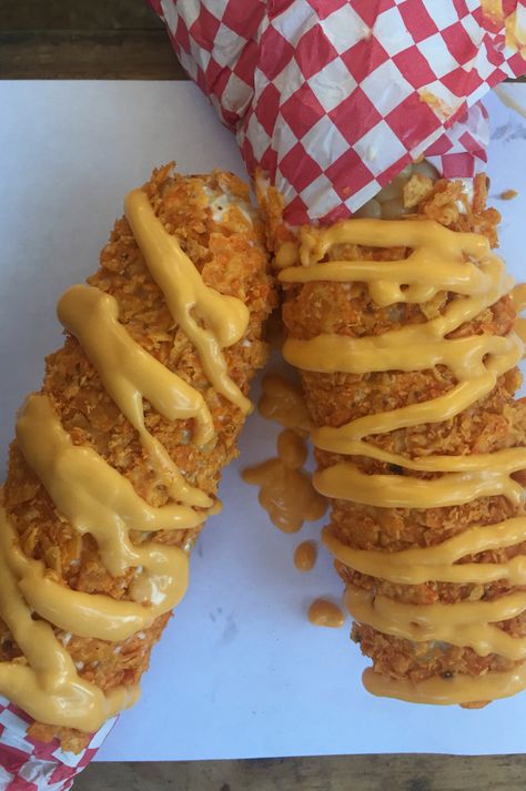 Cheesy Nacho Corn on the Cob: Roasted corn on the cob lightly coated with crushed Dorito® corn chips and nacho cheese. At Texas Steak Out, located on the west side of Underwood St. between Lee & Randall avenues. (Courtesy of Minnesota State Fair) Carnival Eats Recipes, Minnesota State Fair Food, Roasted Corn On The Cob, Carnival Eats, Carnival Foods, Texas Steak, Fair Recipes, Gameday Food, Fair Foods