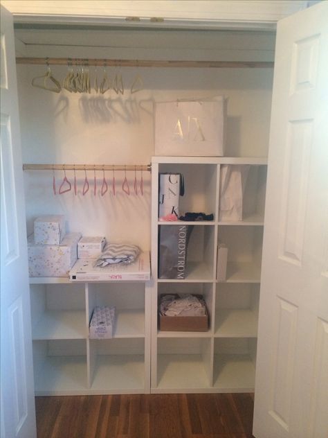 DYI baby closet with IKEA Kallax units & wooden rods by the hubby Ikea Cube Storage In Closet, Ikea Cube Storage Closet, Nursery Closet With Cube Storage, Cube Storage Wardrobe Diy, Kallax Nursery Closet, Nursery Closet Cube Storage, Ikea Kallax Nursery Closet, Cubes In Closet Storage Ideas, Kallax In Nursery