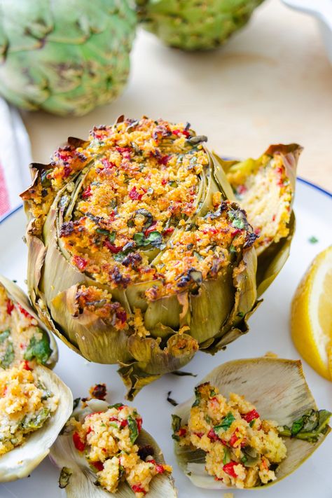 How to cut, cook, and eat whole artichokes plus a stuffed artichoke recipe featuring a breadcrumb mixture with a citrusy vinaigrette. Artichoke Recipe, Cantaloupe Smoothie, Stuffed Artichokes, Spring Dishes, Artichoke Recipes, Vegetarian Appetizers, Food Ingredients, Gluten Free Pasta, Dairy Free Recipes