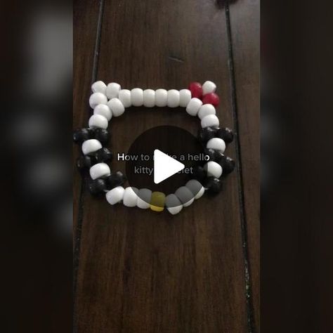 TikTok · (｡’▽’｡)♡ Hello Kitty Bracelet Tutorial, Hello Kitty Kandi, Bead Bracelet Tutorial, Hello Kitty Bracelet, Jazmin Bean, Bead Stringing, Bracelet Tutorial, Red Bead, White Beads