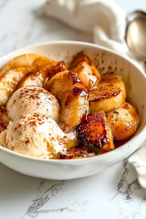 These baked apple slices are coated in warm cinnamon and sugar. Served with vanilla ice cream, they're an irresistible treat! Easy Cinnamon Cookies, Creamy Vanilla Ice Cream, Baked Apple Slices, Apple Ice Cream, Baked Apple Dessert, Fall Apple Recipes, Apple Cinnamon Muffins, Good Recipes, Baked Fruit