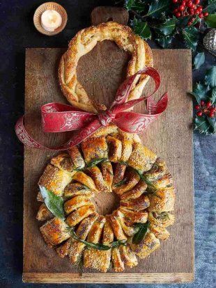 This is a Christmas wreath of two halves – a perfectly seasoned, classic sausage roll and a veggie cheese roll packed with squash, chestnut and cranberry. Sausage Wreath Christmas, Sausage Roll Wreath Christmas, Christmas Sausage Rolls, Jamie Oliver Christmas Recipes, Sausage Roll Wreath, Jamie Oliver Christmas, Christmas Sausage, Roll Wreath, Christmas Canapes