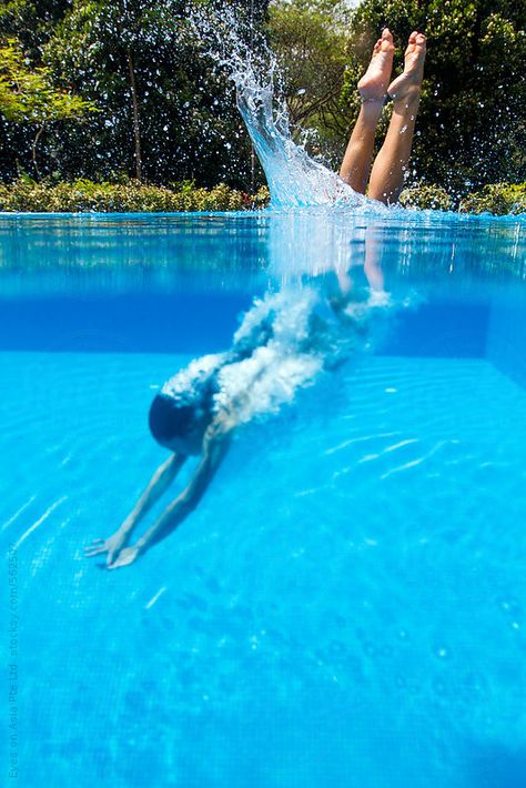 A young asian woman is diving head-on into the pool. The image captures her half in and half out of the water. Metabolic Meals, Swimming Pool Photography, Swimming Aesthetic, Bio Pool, Swimming Pool Pictures, Swimming Photography, Swimming Photos, Swimming Pictures, Diving Pool