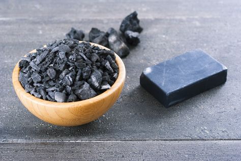 Activated charcoal, also known as activated carbon, is a powder made when common charcoal is heated in such a way as to develop lots of internal spaces or ‘pores’ which help to trap chemicals. This pure black powder – which is used in gas masks and water purifiers – is also sold in capsule form, and is a common additive in many skincare products. You… [read more] Activated Charcoal Uses, Charcoal Mask Benefits, Activated Charcoal Benefits, Raw African Black Soap, Charcoal Uses, Charcoal Bar, Charcoal Soap, Stained Teeth, Coffee Staining