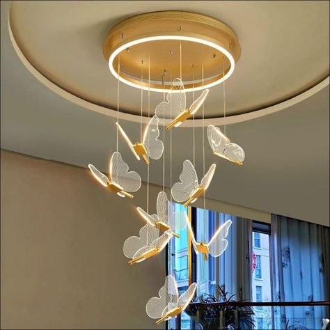 Add a unique and luxurious touch to any room in your home with the Gold Butterfly LED Chandelier. Crafted with a stunningly eye-catching butterfly design, this chandelier is sure to bring a modern and sophisticated feel to your home. Made with durable hardware and stunning crystal accents, the polished gold steel finish will add an extra touch of glamour and elegance. Perfect for a grand foyer, entryway, dining room, event space, or any area in your home in need of an upgrade. Complete your spac Butterfly Chandeliers, Adjustable Pendant Light, Staircase Chandelier, Elegant Chandeliers, Luxury Chandelier, Chandelier Bedroom, Led Pendant Lights, Hanging Pendant Lights, Metal Lighting