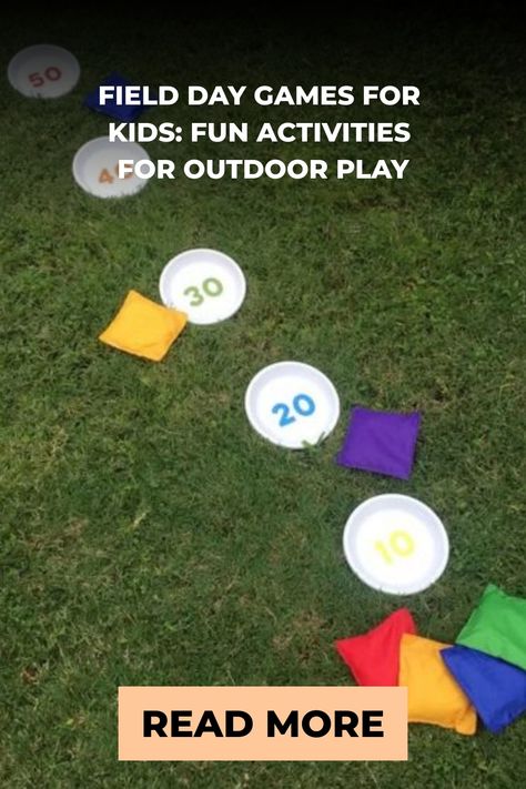 Colorful bean bags and round number markers placed on grass for outdoor children's game with a 'Read More' clickable overlay at the bottom. Field Day Crafts For Kids, At Home Field Day Ideas, Homeschool Field Day Activities, Toddler Field Day Games, Field Day Games For Kids Preschool, Elementary Field Day Games, Elementary School Field Day Ideas, Field Day Games For Kids, Elementary Field Day