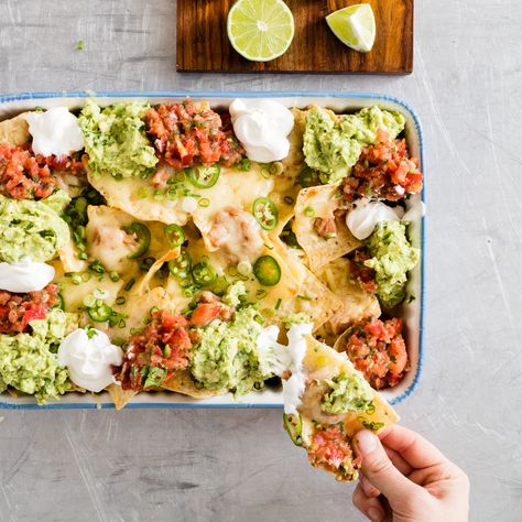 Even this beleaguered staple of mall restaurants is worth doing well at home. Nachos With Refried Beans, Creative Plating, Making Salsa, Best Nacho Recipe, Salsa And Guacamole, Nacho Recipe, Cooks Illustrated Recipes, Bean Nachos, Refried Bean