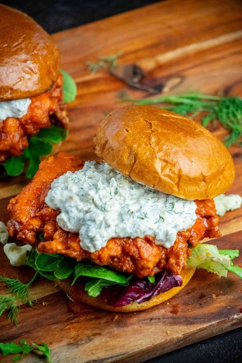 This crispy, crunchy, flavor-packed, buttermilk marinated buffalo chicken sandwich recipe uses a special ingredient for ultra-crispy breading, with a tangy homemade dilly blue cheese sauce and toasted brioche buns! Blue Cheese Chicken Recipes, Lunch Ideas Men, Crunchy Chicken Sandwich, Feel Good Foodie Recipes, Buffalo Chicken Sandwich Recipes, Breaded Buffalo Chicken, Butter Chicken Sandwich, Buffalo Sandwich, Crunchy Sandwich