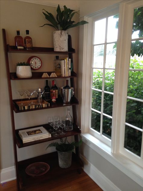 I repurposed a client's ladder shelf, which was destined for the curb, into a sleek and fun bar stand. Cocktails make everything better! Bar Shelf Ideas, Bookshelf Bar, Ladder Shelf Decor, Shelf Inspiration, Bookcase Bar, Spanish Home Decor, Dining Room Shelves, Simple Bedroom Decor, Bar Stand