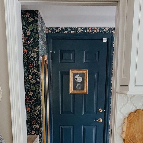 Stephanie Kane on Instagram: "Someone asked if I painted the other door in the mudroom…I sure did and here she is. I even hung some art on her! I got many references to the picture frame on Monica and Rachel’s door on friends! I’ll take it! Let’s start a new trend - art on doors!! #artondoors #painteddoor #paintedtrim #wallpapermudroom #riflepaperco #navypaint #bhghome #betterhomesandgardens #housebeautiful #sodomino #thecottagejournal" Hanging Art On Doors, Painting Pocket Doors, Painted Door Bedroom, Wallpaper On Door, Art On Door, Painted Door Frames, Barn House Kitchen, Painted Bedroom Doors, Monica And Rachel