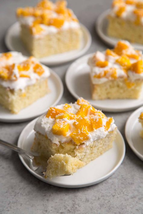 Enjoy a taste of the tropics with this mango coconut sheet cake. Vanilla sponge cake is soaked with coconut milk and topped with fresh mango and dried shredded coconut. Banana Coconut Cake, Coconut Sheet Cake, Mango Coconut Cake, Coconut Sheet Cakes, Vanilla Sheet Cakes, Coconut Cake Recipe, Mango Cake, Banana Cake Recipe, Fruit Toppings