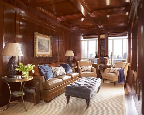 This elegant living room, located in a Central Park West apartment, beams with a warm, hardwood interior and coffered ceiling. Light blue accents soften the dark space. Living Room New York, Celerie Kemble, Paneled Library, British Interior, Colonial Furniture, Manhattan Apartment, Transitional Living, Transitional Living Rooms, New York Apartment