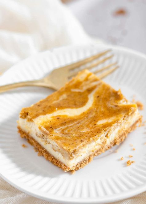 These Pumpkin Cheesecake Bars are swirled with the flavors of pumpkin pie and creamy cheesecake on a buttery graham cracker crust. They are loved by all and are the perfect fall dessert! Pumpkin Swirl Cheesecake, Pumpkin Cheesecake Bars, Pumpkin Pie Mix, Cracker Crust, Cream Cheese Spreads, Mix Recipes, Fall Dessert, Dessert Buffet, Cake Mix Recipes