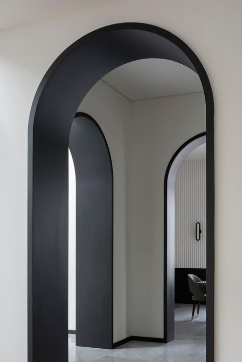 The black lined arches meet with the trim at the bottom of the walls, which wraps around the rooms, as well as the black window frames and stairs structure. Black Window Frames, Built In Bathtub, Custom Drapery, 아파트 인테리어, Interior Architect, Residential Interior, Interior Design Trends, 인테리어 디자인, Door Design