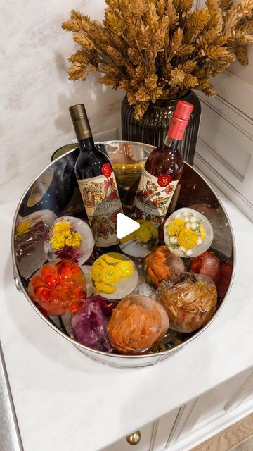 Ashley Savage | Creator | Atlanta, GA on Instagram: "🍂DIY Fall Floral Ice Bucket🍂 comment SHOP to get the links to this fall DIY sent to you! This is such a fun one for all your fall gatherings! I took fall florals and added them to a balloon, filled it with water, and put them in the freezer! Once frozen, cut the balloon and peel it off. You can run it under water to make the flower pop a little better! Display them in an ice bucket with your favorite beverages!🍾
•
•
•
#falldiy #fall #fallvibes #fallideas #fallflorals #partyideas #thanksgivingideas #fallfestivities #fallseason #falldecorations #falldecorating #diyideas #diy" Floral Ice Bucket, Fall Instagram, Floral Ice, Flower Ice, Fall Gathering, The Cardigans, Fall Florals, Ice Ball, One For All