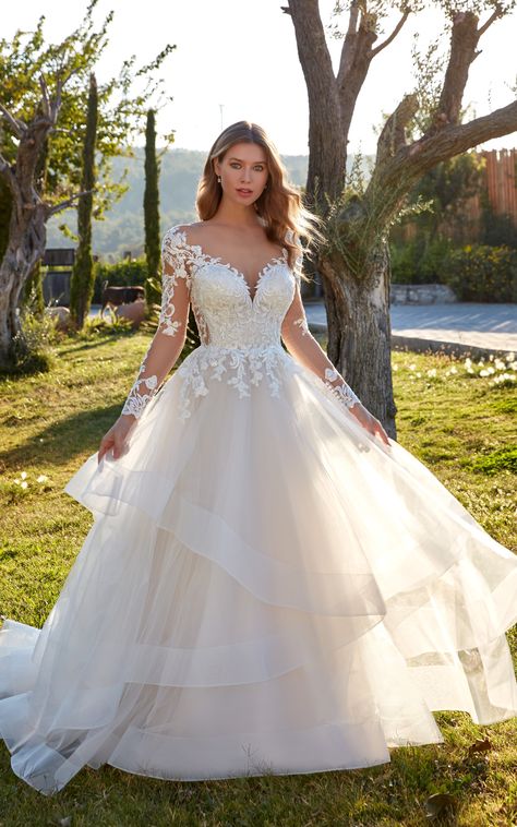 HEATHER is a beautiful long sleeves ballgown with ivory tulle horsehair layered ballgown with beaded ivory lace and sequins. Style: #heather_ek1509 #ballgownweddingdress #ballgown #ballgowndress #ballgowndresses #bridalgowndesigner #bridalgownshopping #bridalgowns #weddinggowns #longsleevedress #longsleeveweddingdress #winterwedding Layered Tulle Wedding Dress, Layered Wedding Dresses, Eddy K, Long Sleeve Wedding Dress, Designer Bridal Gowns, Stunning Wedding Dresses, Lace Dress With Sleeves, Sleeve Wedding Dress, Long Sleeve Wedding