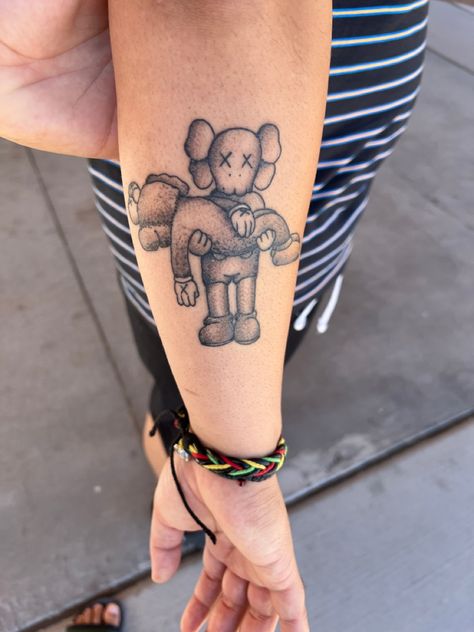 Small Kaws Tattoo, Kaws Tattoo Ideas Leg, Kaws Sleeve Tattoo Ideas, Kaws Doll Tattoo, Hype Beast Tattoo, Kaws Tattoo Ideas For Women, Kaws Tattoo Ideas For Men, Kaws Tattoo Stencil, Bape Tatoos