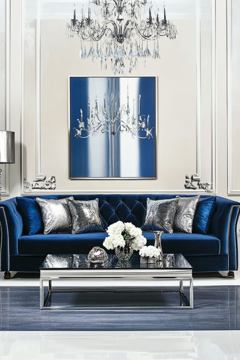 Blue and silver offer an endless array of possibilities for your living room design. From minimalist and contemporary to traditional and eclectic, these 26 ideas showcase the versatility of this color combination. Explore stunning furniture designs, decorative accents, and color palettes to create a living room that reflects your unique style. Blue And Silver Living Room, Silver Living Room Ideas, Upholstered Window Seat, Blue Bookshelves, Blue Leather Sofa, Blue Velvet Armchair, Silver Wall Clock, Silver Ceiling Fan, Silver Living Room