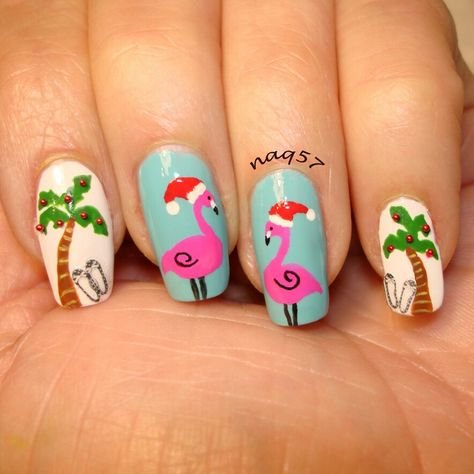 a tropical Christmas nail art                                                                                                                                                                                 More Christmas Beach Nails Art Designs, Beach Christmas Nail Art, Christmas In July Nail Designs, Palms Nails Design, Palm Tree Christmas Nails, Christmas Palm Tree Nails, Christmas Flamingo Nails, Christmas Tropical Nails, Christmas Summer Nails