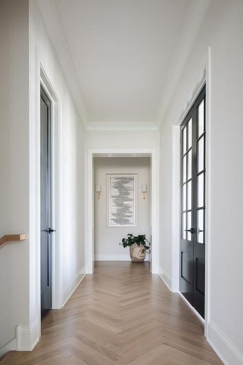 Transitional mudroom hallway finished with oak herringbone wood floors and black closet doors. Transitional Mudroom, Wood Floor Design, Herringbone Wood Floor, Herringbone Wood, White Oak Hardwood Floors, Hallway Flooring, Oak Hardwood Flooring, Herringbone Floor, White Oak Floors