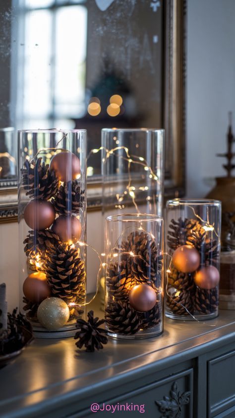 Pinecone Lights Vase, Pinecone Christmas Table Decor, Diy Pinecone Centerpiece, Cocktail Table Centerpieces Christmas, Cosy Christmas Decorations, Christmas Rustic Table Decor, Gnome Christmas Decor Ideas, Cylinder Vase Centerpiece Christmas, Pinecone Table Centerpieces