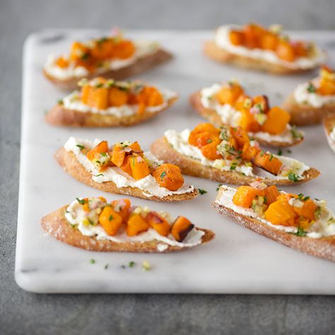 Crostini with Butternut Squash, Ricotta and Preserved Lemon | A preserved lemon relish adds a bright, salty note to these elegant crostini, balancing the flavors of creamy ricotta and sweet squash. Squash Crostini, Butternut Squash Ricotta, Preserved Lemon, Crostini Recipes, Elegant Appetizers, Toast Toppings, Delicious Thanksgiving, Thanksgiving Appetizers, Buffalo Wings