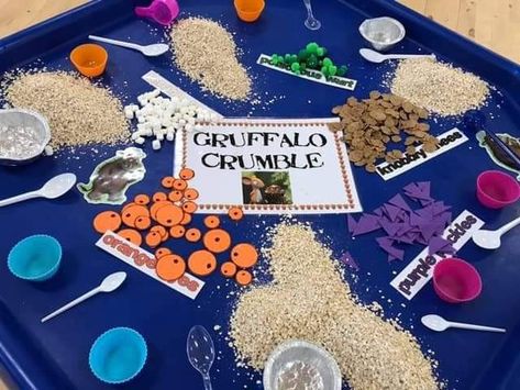 Bran flakes for knobbly knees.  Mini marshmallows for his terrible teeth.  Green pom poms for poisonous wart. Purple felt cut into triangles for purple prickles. Orange foam cut out for eyes.  Oats for the topping. The Gruffalo Tuff Tray Ideas, Storytelling Week Eyfs, Into The Woods Eyfs, The Gruffalo Tuff Tray, Goldilocks Tuff Tray, Gruffalo Crumble Tuff Tray, The Gruffalo Eyfs, Smartest Giant In Town Activities Eyfs, The Gruffalos Child Activities