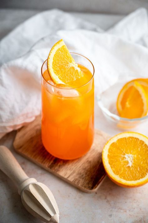 With vodka, orange liqueur, freshly squeezed orange juice, and orange soda, we couldn't think of anything more refreshing to sip on in the heat. These are delicious on a hot day by the pool. They're so easy to make, plus you could make a whole pitcher for a group. #orange #cocktail #orangecrush Adrenal Cocktail Recipe, Crush Drink, Orange Crush Cocktail, Homemade Gatorade, Kettle Corn Recipe, Adrenal Cocktail, Orange Crush Soda, Salisbury Steak Recipes, Sour Beer