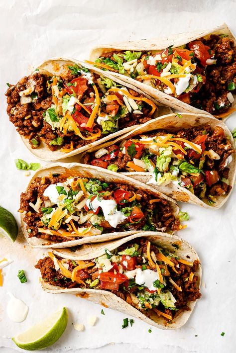 Five ground beef tacos arranged on parchment paper. Taco Dinner Ideas Ground Beef, Ground Beef Taco Recipes, Tacos Ground Beef, Taco Recipes Ground Beef, Make Taco Seasoning, Ground Beef Taco, Weeknight Dinner Recipes, Beef Tacos Recipes, Fresh Corn Salad