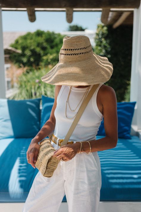 Styling Essentials For Travel - Julia Berolzheimer Janessa Leone Hat, Summer Travel Essentials, Styling Essentials, Wide Brim Bucket Hat, Illesteva Sunglasses, Straw Boater Hat, Straw Boater, Bottega Veneta Bag, Julia Berolzheimer