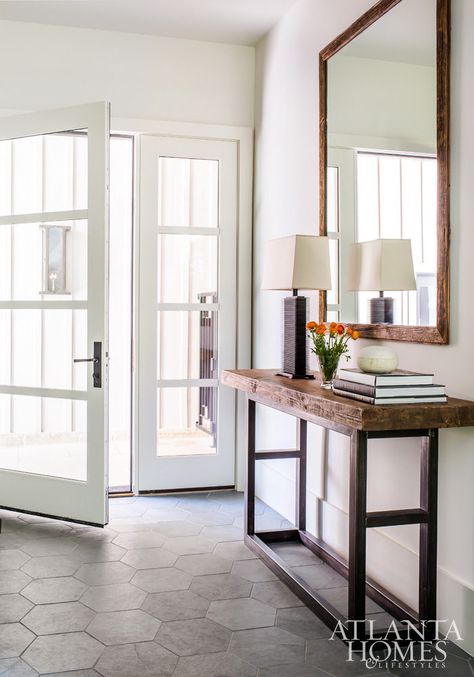 Custom hexagonal slate tiles, designed by Sheehan, add a natural and functional stone element to the minimal foyer and mudroom. Entryway Tile, Foyer Flooring, Entry Tile, Entryway Flooring, Harrison Design, Fresh Farmhouse, Farmhouse Entryway, Hallway Design, Hal Decor