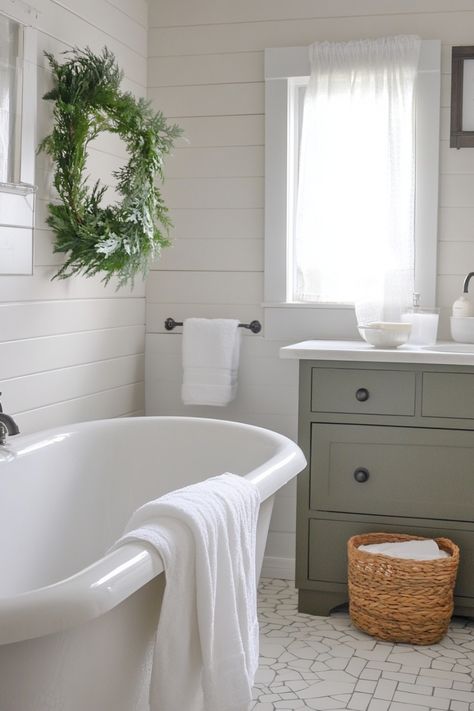 Elegant bathroom with a white freestanding tub and green vanity. Coastal Farmhouse Bathroom, Small Farmhouse Bathroom, Coastal Farmhouse Style, Coastal Farmhouse Decor, Farmhouse Paint, Cottage Bathroom, Bathroom Paint Colors, Coastal Bathrooms, Modern Farmhouse Bathroom