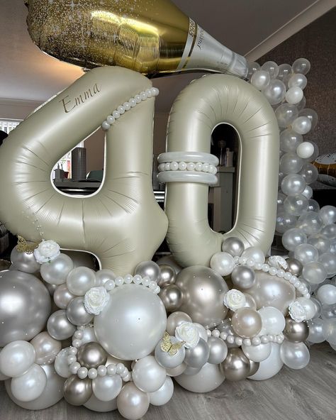 40th balloon stack with champagne bottle and bubbles 
Cream number balloons Pearl White Balloon Garland, Pearl Birthday Theme, How To Make Pearl Balloon Strands, Pearl Balloon Garland, Pearl Party Decorations, Balloon Pearl Strands, New Years Eve Balloon Back Drop White, Balloon Stack, Roaring 20s Birthday Party