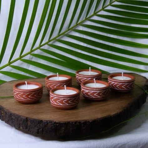 Hand painted Terracotta Soy wax mini candles- Arrows Design Dimensions - Dia 2.25" X H 1" Material - Terracotta & Soy Wax Color - Terracotta and white Features - Hand painted,Eco-friendly . . #clayart #post #postoftheday #positivevibes #celebration #festivevibes #diya #candle #brand Hand Painted Diyas, Boho Arts, Diya Candle, Candle Shoot, Terracotta Diy, Terracotta Candle, Arrows Design, Handmade Candles Diy, Candle Photography