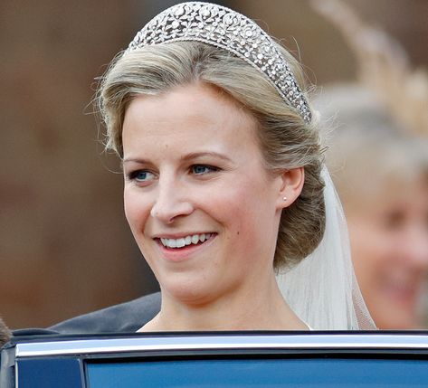 CafeMom.com : Iveagh Tiara : The Most Exquisite Royal Tiaras & Their Fascinating History -- Queen Mary received the Iveagh Tiara from Lord and Lady Iveagh, and she passed it down to her daughter-in-law, Princess Alice, Duchess of Gloucester. Over the years since, it's also been called the Gloucester Leafage Tiara. In 2008, Lady Rose Windsor, daughter of the current Duke and Duchess of Gloucester, wore the crown at her wedding. Poltimore Tiara, Duchess Of Gloucester, Lovers Knot Tiara, Lord And Lady, Floral Tiara, History Queen, Flower Tiara, Princess Alice, Royal Tiaras