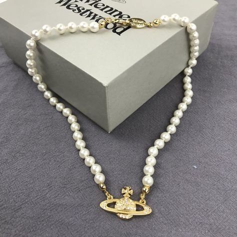 "Brand New Vivienne Westwood Gold Orb Pearl Choker Necklace Button Necklace Brand New, Never Worn, Nwot 100% Authentic Comes With Gift Box, Gift Bag, And Dust Bag,Brand Cards,Instruction Manual,Jewelt Cloth. Full Packing As Inculded. Necklace Packed In Secure Packaging For Transit The Length Was : 16.5'' Welcome To Share And Offer Vienna Westwood Necklace, Jewellery Vivienne Westwood, Vivienne Westwood Gold Jewellery, Trendy Gold Necklaces, Vivian Westwood Neckles, Vivienne Westwood Gold Necklace, Vivienne Westwood Pearl Necklace Outfit, Gold Vivienne Westwood Necklace, Pearl Vivienne Westwood