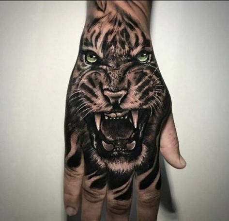 25 Tiger Tattoo on Hand Ideas Tiger Hand Tattoo Men, Palm Size Tattoos, Tiger Hand Tattoo, Tattoo Main, Lion Hand Tattoo, Hand Tattoo Images, Herren Hand Tattoos, Fierce Tattoo, Animal Tattoos For Men