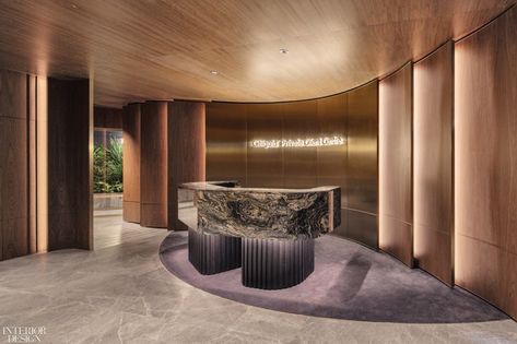 Walnut-veneered walls and a polished marble desk define the upstairs reception area for private banking clients. The founder and director of Ministry of Design, Colin Seah, admits that his firm was not an obvious choice to design a high-end bank. “We’re a bit of a black sheep,” he says. #InteriorDesign #ModernOffice #WorkplaceDesign Bank Interior, Smart Lighting System, Private Banking, Walnut Timber, Marble Desk, Marble Bar, Bank Design, Timber Walls, Wall Feature