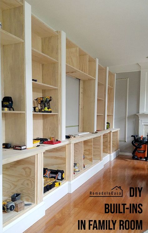 DIY - Family Room Built-Ins - Building and Installing The Shelves - Remodelando la Casa #thdprospective Built In Storage Shelves Basement, Built In Shelves Basement Family Room, Diy Living Room Cabinets Built Ins, Build Your Own Built In Bookcase, Wainscoting Family Room, Living Room Built Ins Diy, Diy Built In Bookcase Around Tv, How To Make Built In Cabinets, Diy Living Room Built Ins With Tv