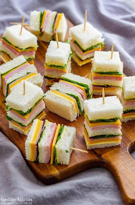 Elevate your next gathering with these irresistible mini sandwiches that are sure to be a hit with guests of all ages. Perfectly portioned and packed with flavor, these bite-sized delights are the ultimate crowd-pleasers. Whether you're hosting a casual get-together or a sophisticated soirée, these mini sandwiches offer endless possibilities for customization. From classic combinations to creative new twists, they're easy to assemble and even easier to enjoy. Get ready to impress your friends and family with these party-perfect appetizers that are as delightful to look at as they are to eat. Baby Shower Finger Foods, Appetizer Sandwiches, Mini Cucumbers, Party Sandwiches, Ham And Cheese Sandwich, Mini Sandwiches, Easter Decorations Kids, Easter Decorations Diy Easy, Brunch Party