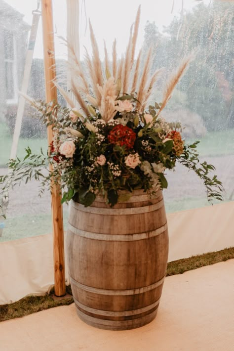 Pampas Grass And Flowers Wedding, Rustic Flowers Arrangements, Large Fall Wedding Floral Arrangements, Pampas Grass Centerpiece Wedding Ideas Diy, Pampas Grass Barrel Arrangement, Barrel Floral Arrangements Wedding, Flowers On Barrels For Wedding, October Farm Wedding, Boho Flower Arrangements Wedding