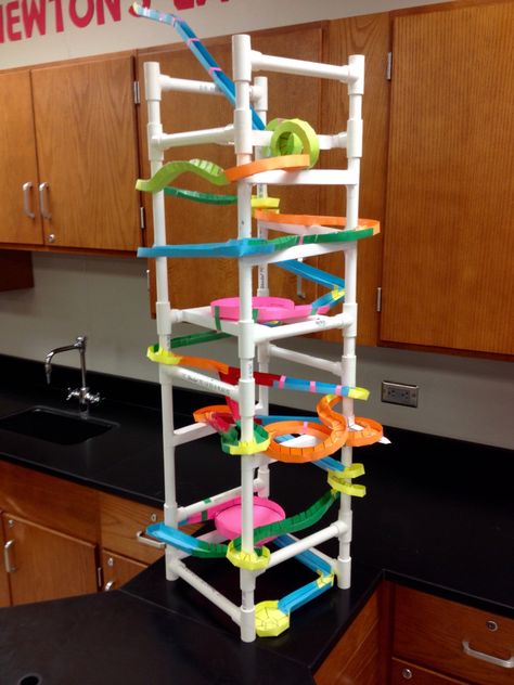 Paper Roller Coaster using 1/2" PVC for structure.  Pipe was cut so beams and columns can be attached.  Total project was $300 for up to 50 groups. Less than $50 every year after. Paper Roller Coaster Project, Paper Rollercoaster, Diy Roller Coaster, Crafts Using Cardboard, Roller Coaster Design, Paper Roller Coaster, Beams And Columns, Cardboard Coasters, Marble Tracks