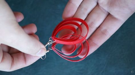 This is a guide to making plastic bottle earrings. Learn how to make plastic earrings out of an old sauce bottle with this easy step-by-step tutorial. Plastic Bottle Earrings, Earring Video, Diy Plastic Bottle, Bottle Earrings, Small Scissors, Make Earrings, Plastic Earrings, Handmade Jewelry Earrings, Long Cut