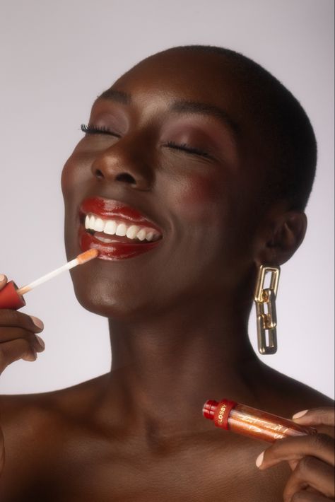 Portrait of model Ebony Ohen, photographed by Ikechukwu Dike. Fenty Beauty, Mented Cosmetics, Elf Cosmetics, Glossier, The Lip Bar cocoa bean, Essence Cosmetics. #beautyproducts #beautyphotography #editorial #naturalhair #portrait #red #lipstick #smile Mented Cosmetics, The Lip Bar, Women Lipstick, Red Colour Palette, Essence Cosmetics, Elf Cosmetics, Beauty Lipstick, Soft Red, Flash Photography