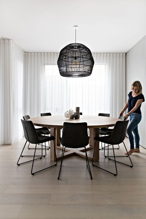 This custom 2m Oak Orbit dining table from the Woodroom is stunning and comfortably seats 8 or 9.  The Mandali Pendant light from Uniqwa Collections creates a beautiful intimacy and clearly dictates the dining zone.  But it's the added texture that really takes this space to another level - the Glosswood Designer Lining feature wall and floor to ceiling sheers add a softness and textural element that gives this space a designer edge. Follow us on Instagram and Pinterest for more design tips. Scandi Dining Room, Round Dining Room Table, Round Dining Room, Dining Room Inspiration, Dining Table Design, The Ceiling, Dining Room Design, Room Table, Round Dining